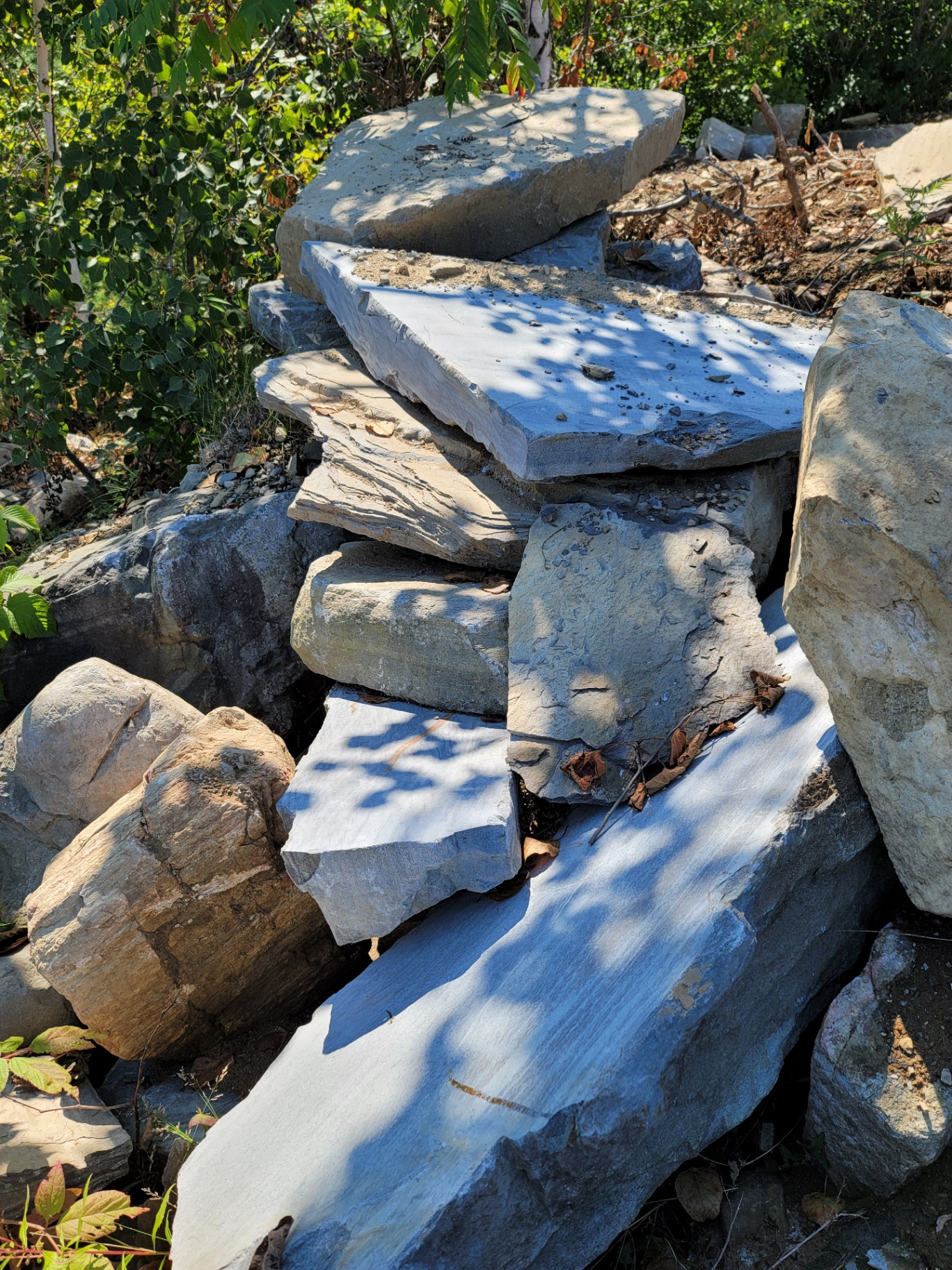 Stack of large flagstone slabs at the quarry